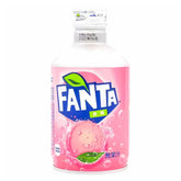 Enjoy a 300ml can of Fanta - White Peach Flavour (Japan) with a pink label, green leaf logo, and peach image. Japanese text highlights this refreshing twist on classic Fanta in a delicious sparkling beverage.